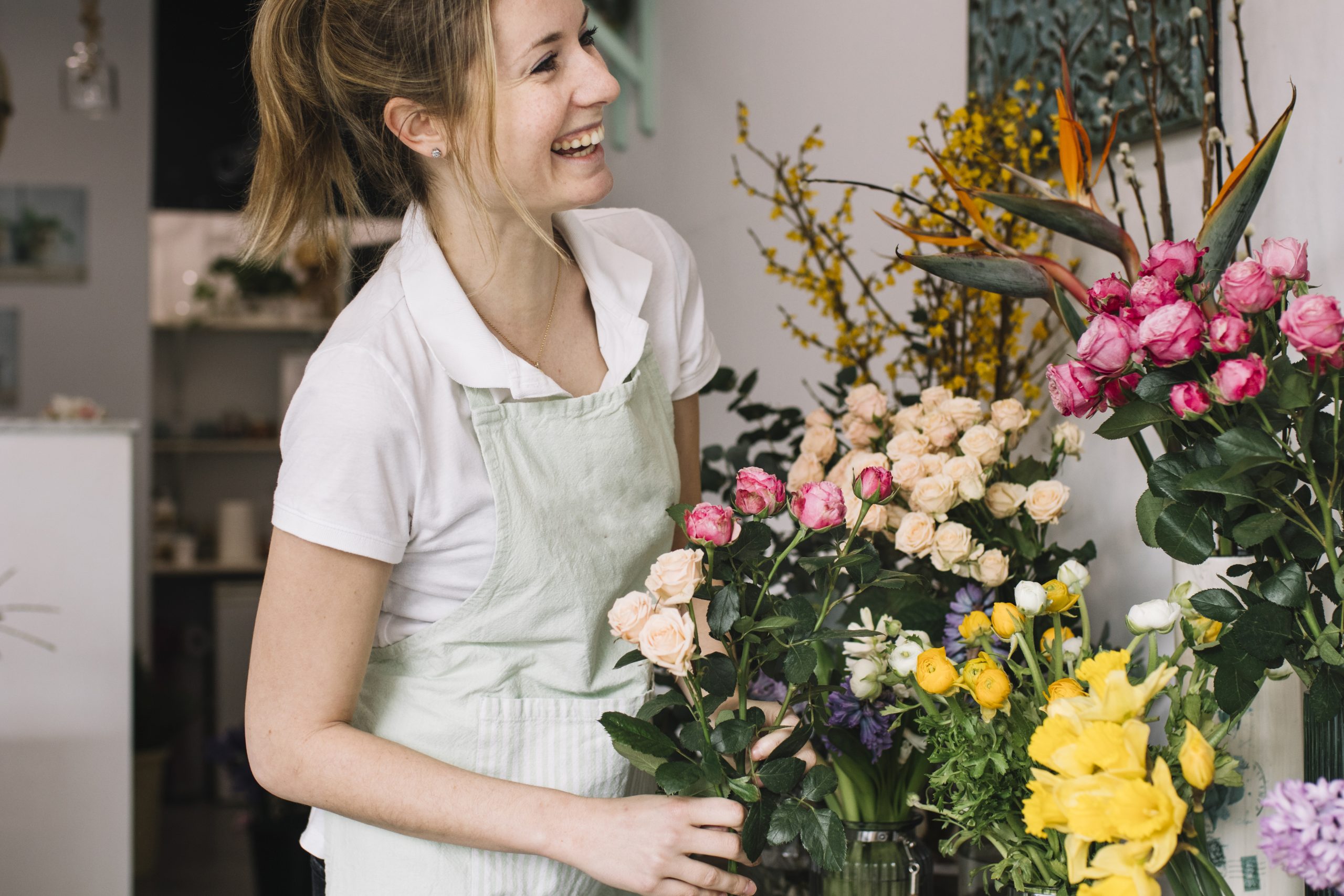 cheerful-florist-near-bouquets